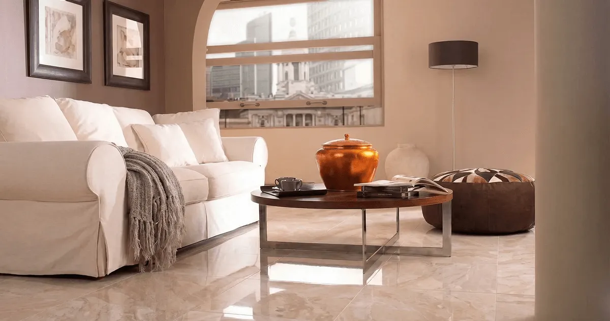 Modern living room with professionally installed marble flooring, a beige sofa, coffee table in Syracuse, NY